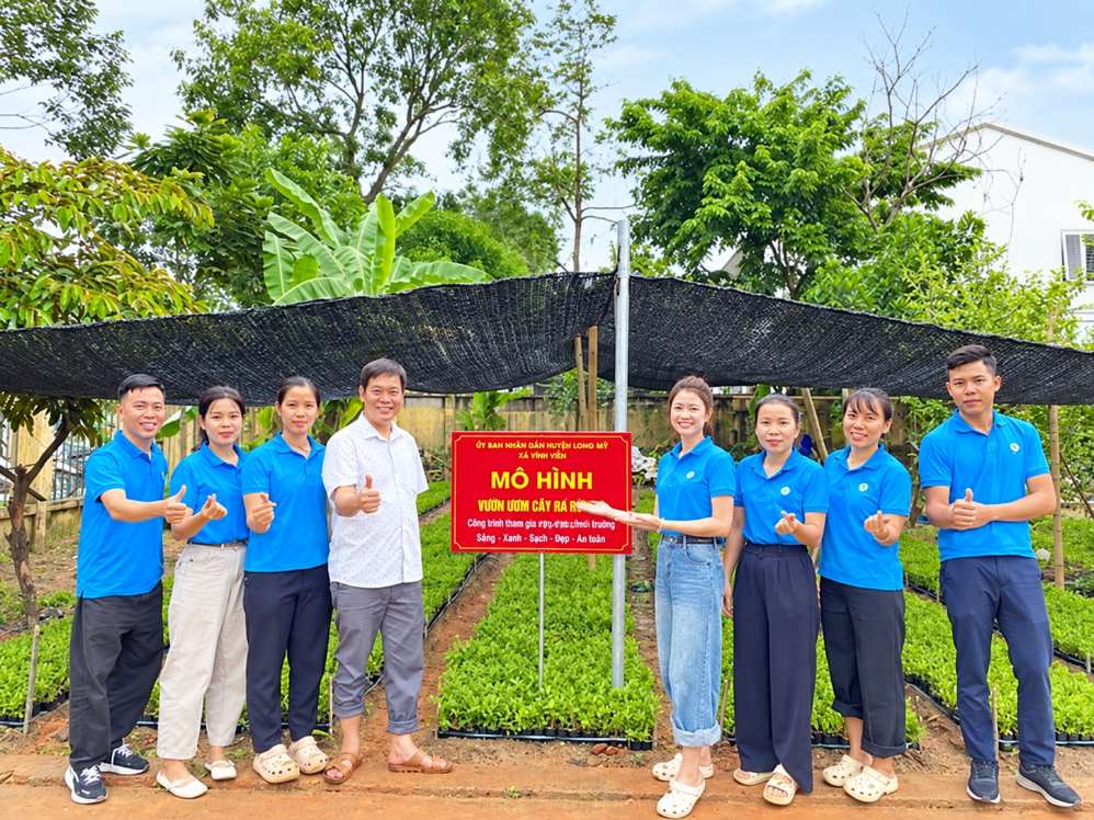 Union members and workers plant trees to build green fences